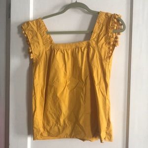 J. Crew yellow top with pom poms